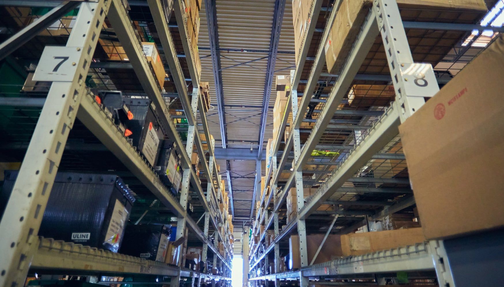 a warehouse with boxes on shelves