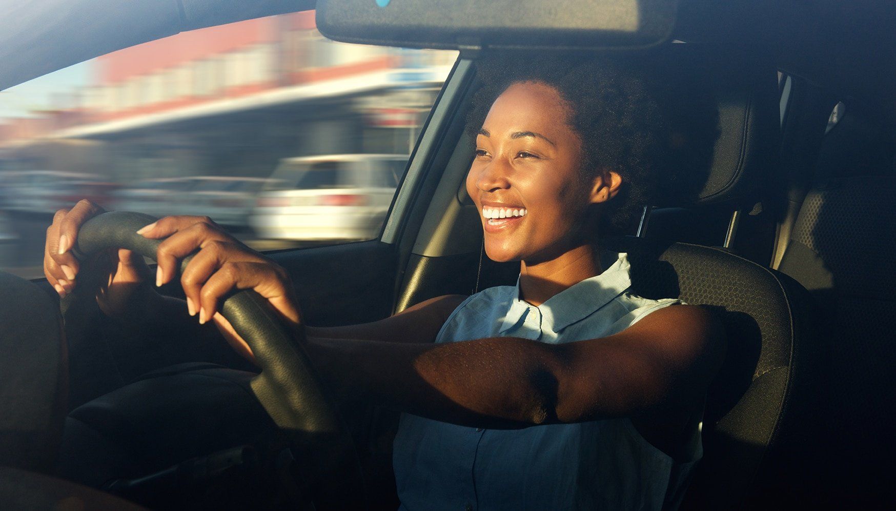 A woman driving a vehicle
