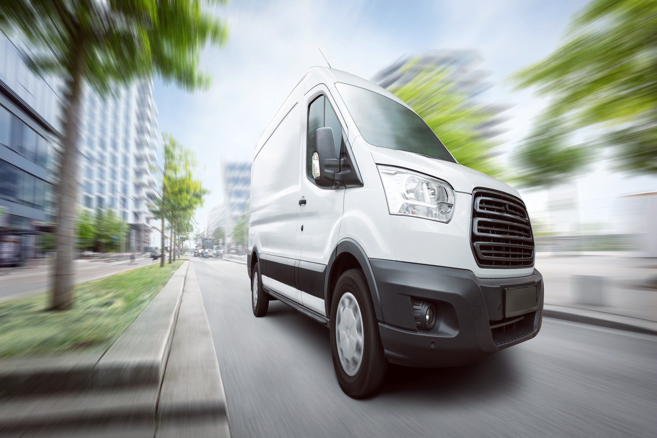 White van speeding through the city
